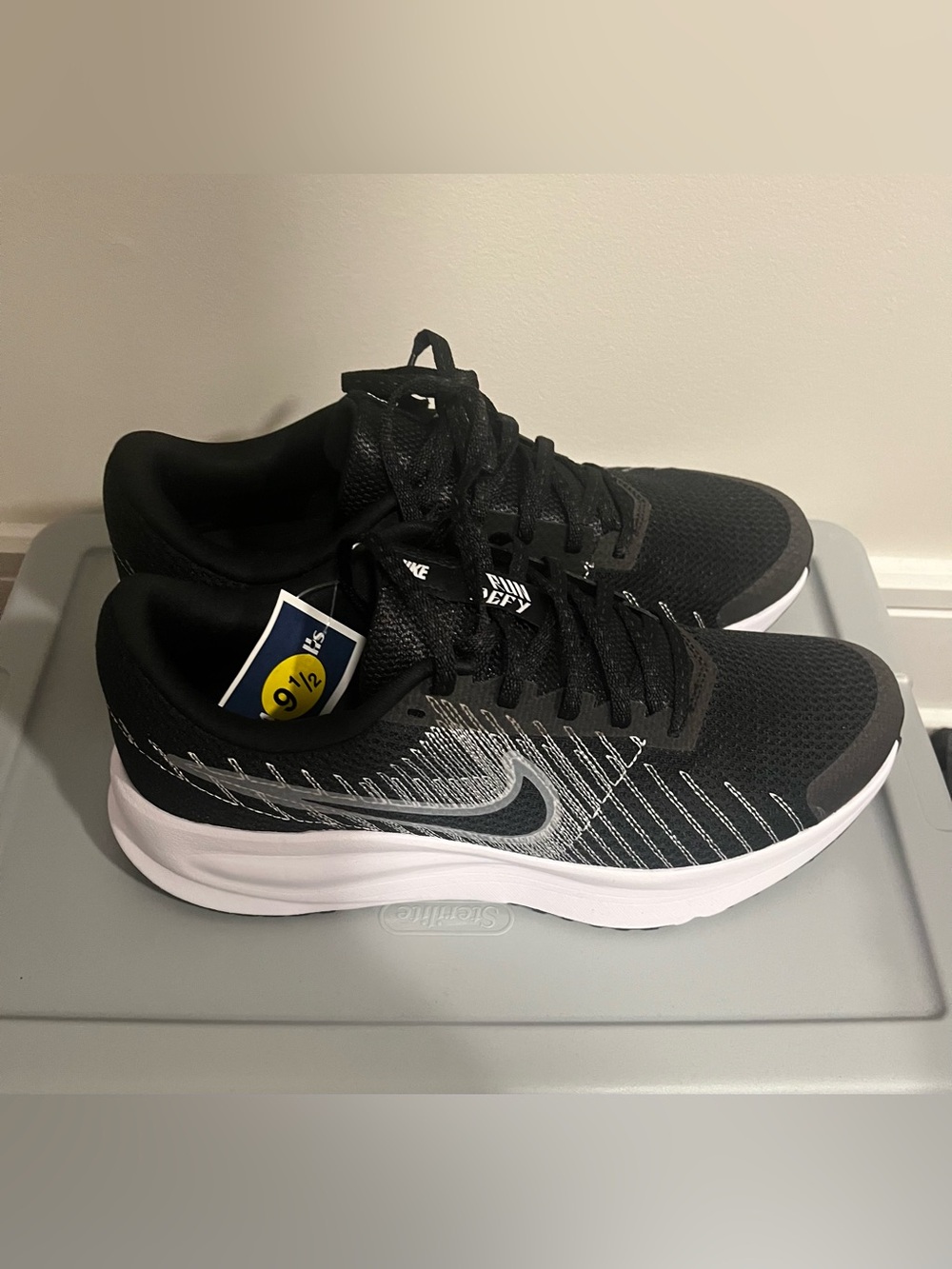 Nike Women’s Black and White Defy Sneakers
